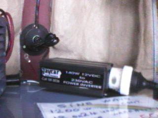 The Inverter pictured will do the trick, retail price $99.